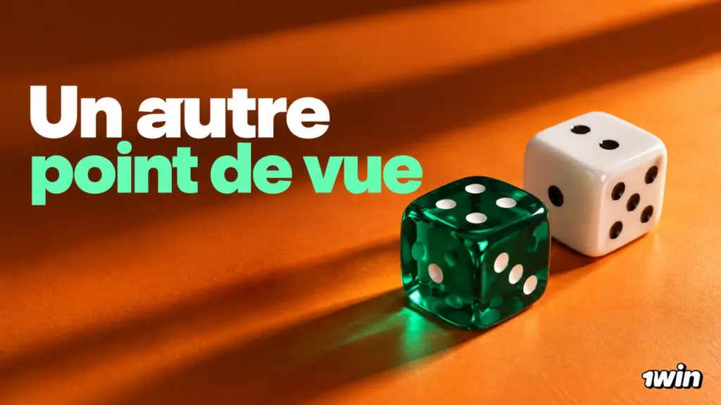 Dé vert et dé blanc sur un tissu orange